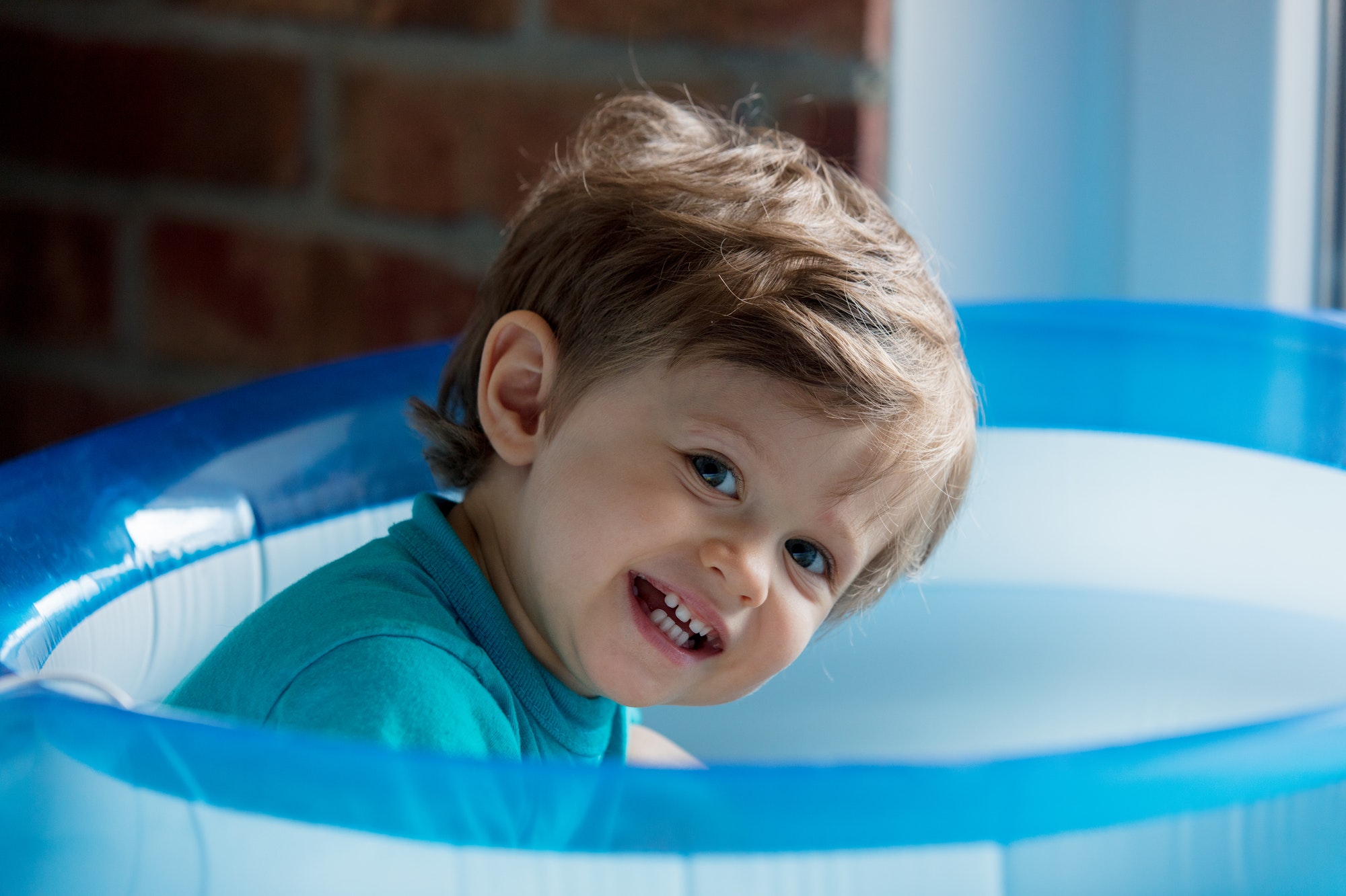 little Toddler is played in an inflatable pool